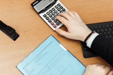 Calculator and papers on the table